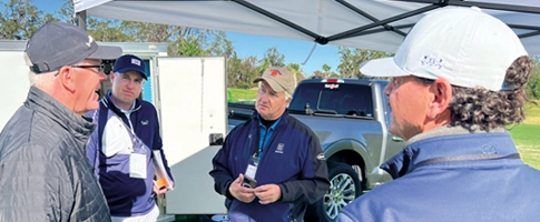 A photo of a group of people talking during a recent Summit