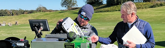 Photo of an attendee and partner discussing a product